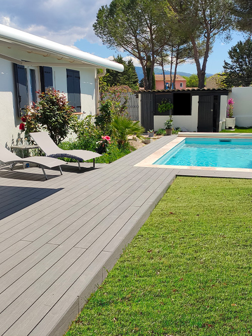 terrasse contour piscine en bois composite neowood. teinte béton